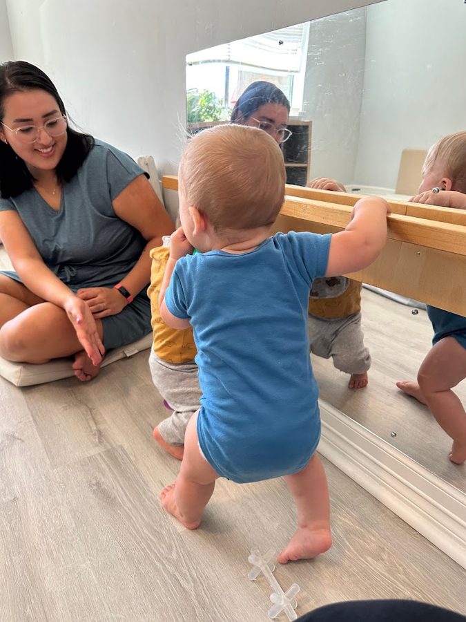 Owen at the pull-up bar with Camilla